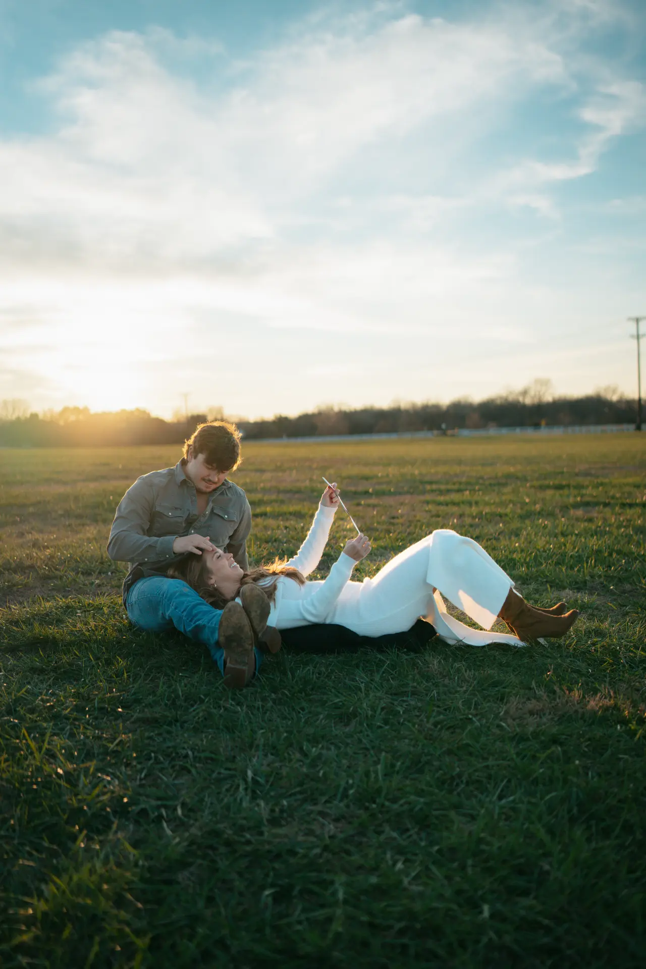Couple laughing during golden hour engagement portrait